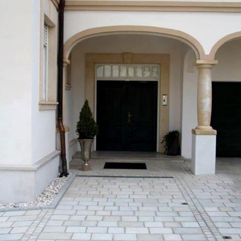 The image shows this product being used in a path pavers application.