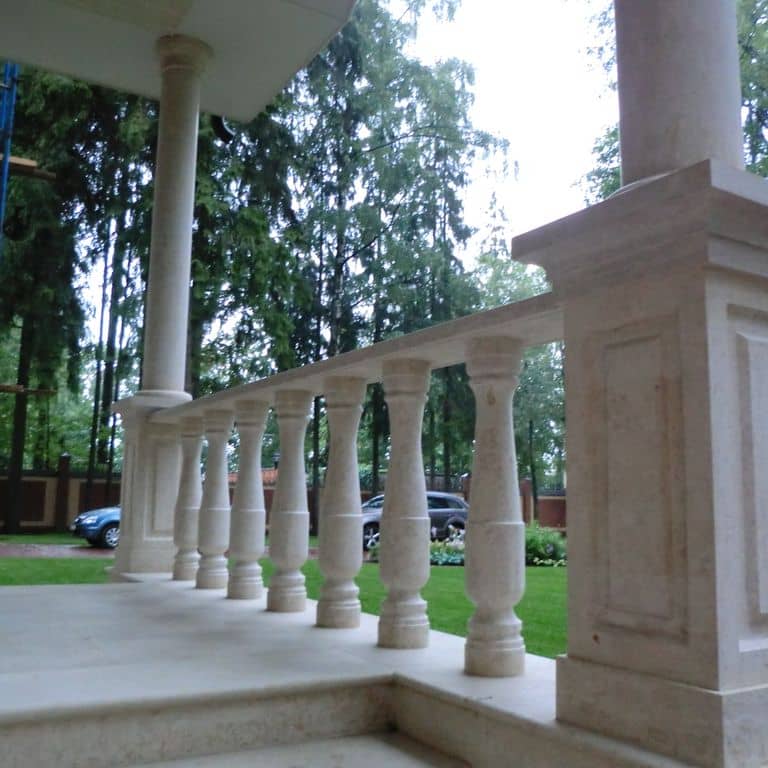 Feature image for Mountain Hard Limestone Beige - Architectural Elements. The image shows this product being used in an architectural elements application. Dominant colors shown are beige, gray and white; with a cream secondary. Exhibits "movement" and the color mix creates a cool feeling. Cloudy color pattern.