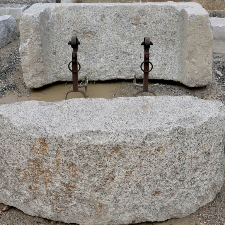 Close-up image for Reclaimed D-Radius Curbstone Seating. The surface finishes shown are weathered and worn. The dominant color shown is gray; with beige, brown, purple and white secondaries. Regular, speckled and blotched color patterns.