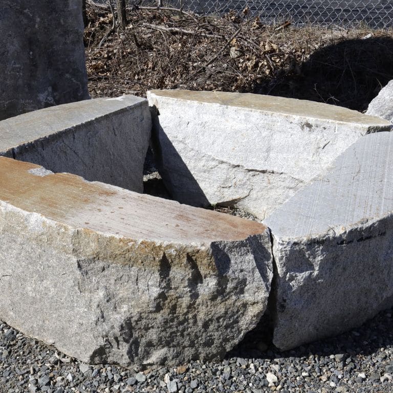 Feature image for Reclaimed D-Radius Curbstone Seating. The image shows this product being used in a seating &amp; benches application. The surface finish shown is a combination of sawn and split-face. Dominant colors shown are brown and gray; with beige, orange/rust, white, tan and cream secondaries. The color mix creates a warm feeling. Regular, blotched and cloudy color patterns.