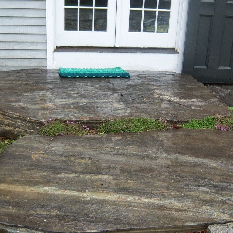Application image for Mystic Mountain Natural - Steps &amp; Landings. The image shows this product being used for landings and monolithic steps. This is a building and landscape stone for outdoor residential applications. Suitable for general use, freeze-thaw conditions, high traffic areas, low slipperiness surfaces and high heel compatibilty situations. Higher to high on the price spectrum.