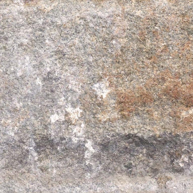 Color/Finish variation image for Reclaimed Granite Curbstone - Junior Wallstone. The dominant color shown is gray; with beige, brown, orange/rust, pink, purple, white, tan and cream secondaries. Exhibits "movement" and the color mix creates a warm feeling. Random, fine speckled, blotched and cloudy color patterns.