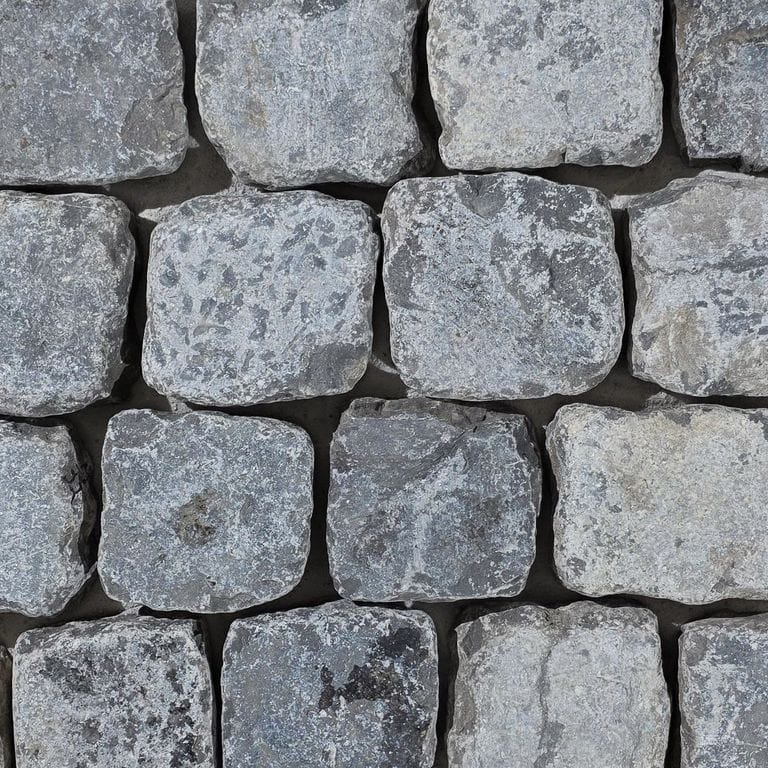 Color/Finish variation image for Reclaimed Belgian Bluestone Cobblestones - Worn Surface. The surface finish shown is . Dominant colors shown are blue and gray. The color mix creates a cool feeling.