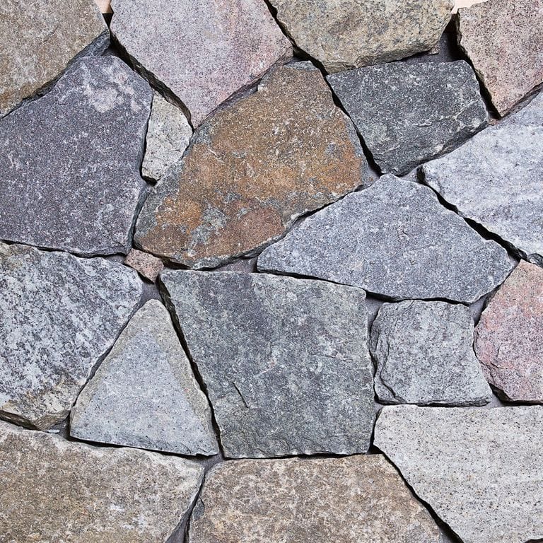 Color/Finish variation image for Adirondack Granite - Veneer. The surface finish shown is . Dominant colors shown are blue, gray and greige. The color mix creates a cool feeling.