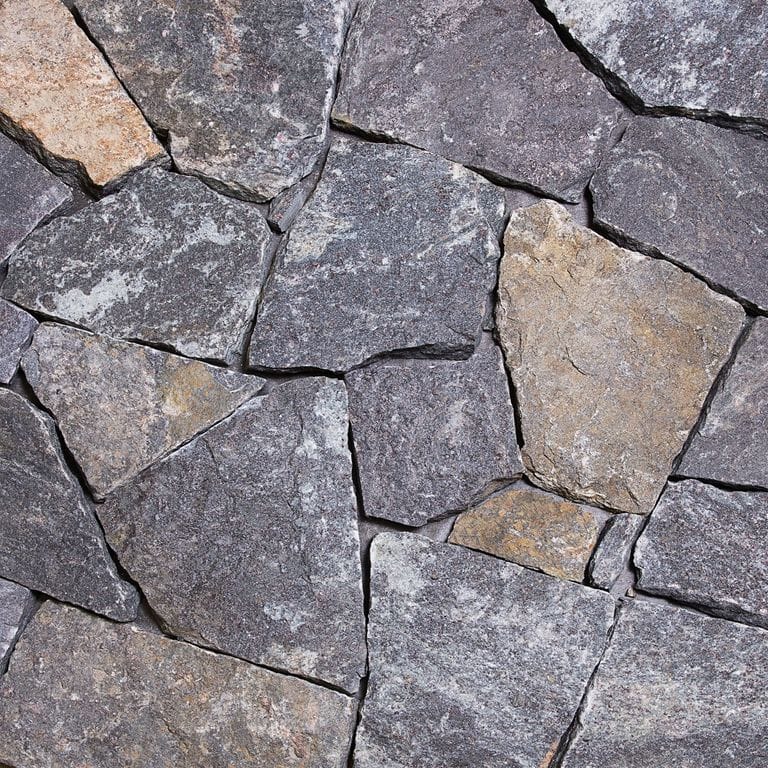 Color/Finish variation image for Dolph Pond Granite - Veneer. The surface finish shown is . The dominant color shown is gray.