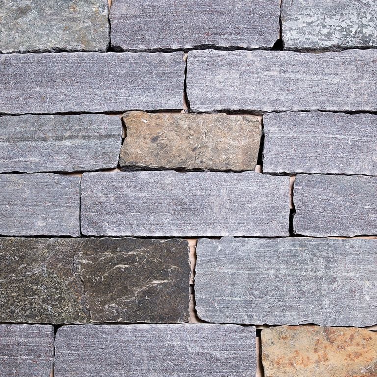 Color/Finish variation image for Dolph Pond Granite - Veneer. The surface finish shown is split-face. The dominant color shown is gray.