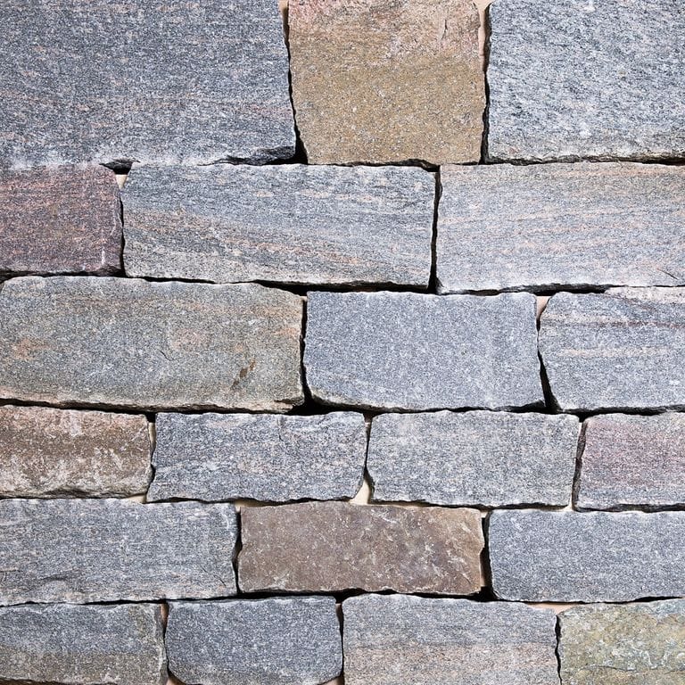Color/Finish variation image for Hawthorne Granite - Veneer. The surface finish shown is split-face. The dominant color shown is gray.