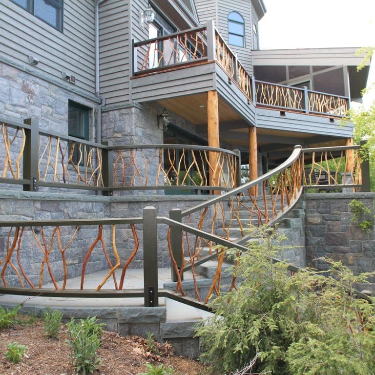 Feature image for Hawthorne Granite - Veneer. The image shows this product being used in a full bed veneer application. The dominant color shown is gray; with beige, blue, brown, orange/rust, purple, white and tan secondaries. Exhibits "movement". Speckled color pattern.