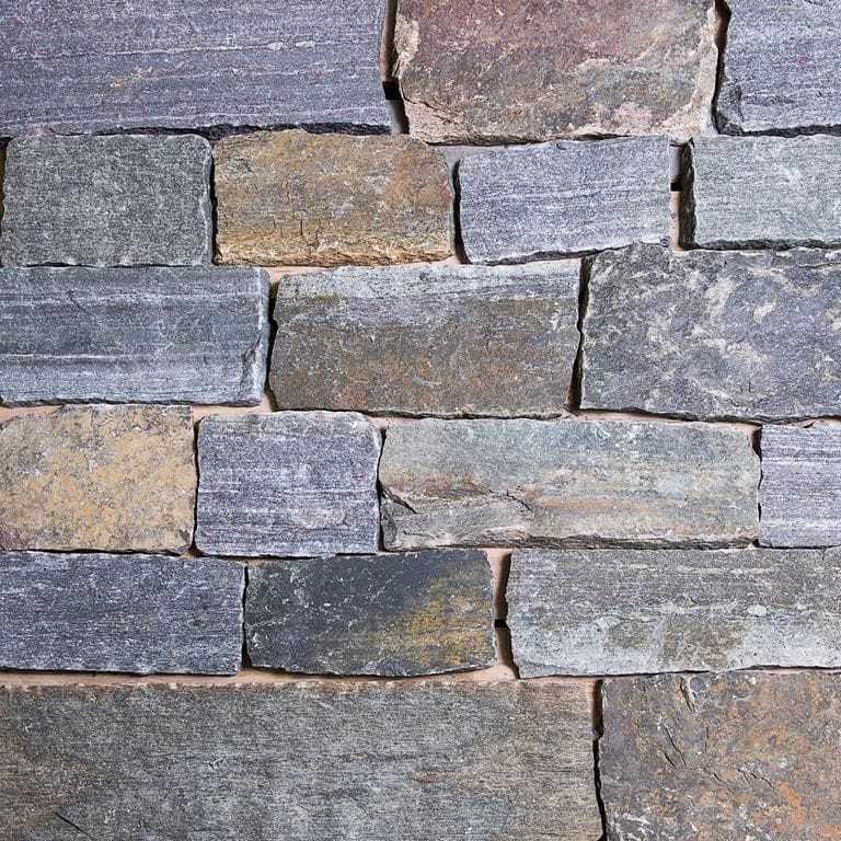 Application image for Lake Champlain Granite - Veneer. The surface finish shown is split-face. Dominant colors shown are blue and gray.