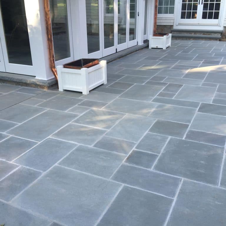 The image shows this product being used in a patio pavers application.
