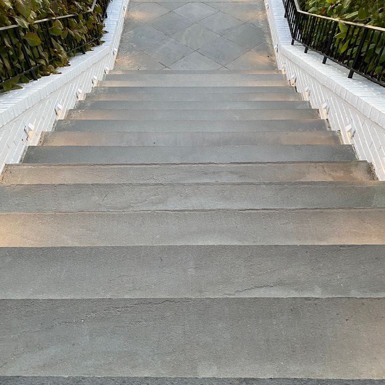 Application image for Bluestone Flamed Surface Blue/Gray - Treads. The image shows this product being used in a treads application. This is a landscape stone for indoor and outdoor commercial and residential applications. Suitable for general use, freeze-thaw conditions, high traffic areas, low slipperiness surfaces and high heel compatibilty situations. Low to moderate on the price spectrum.