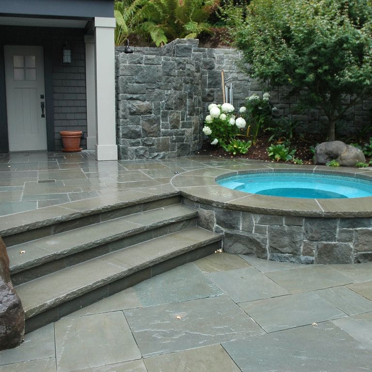 The image shows this product being used in a patio pavers application.