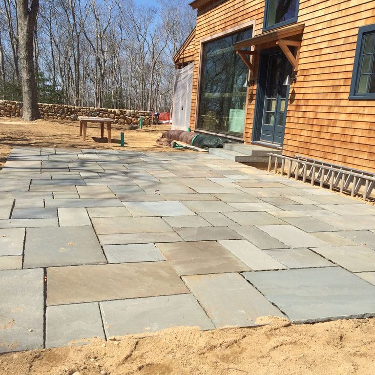 The image shows this product being used in a patio pavers application.