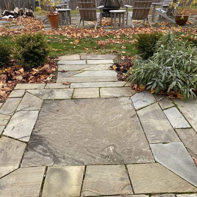 The image shows this product being used in a patio pavers application.