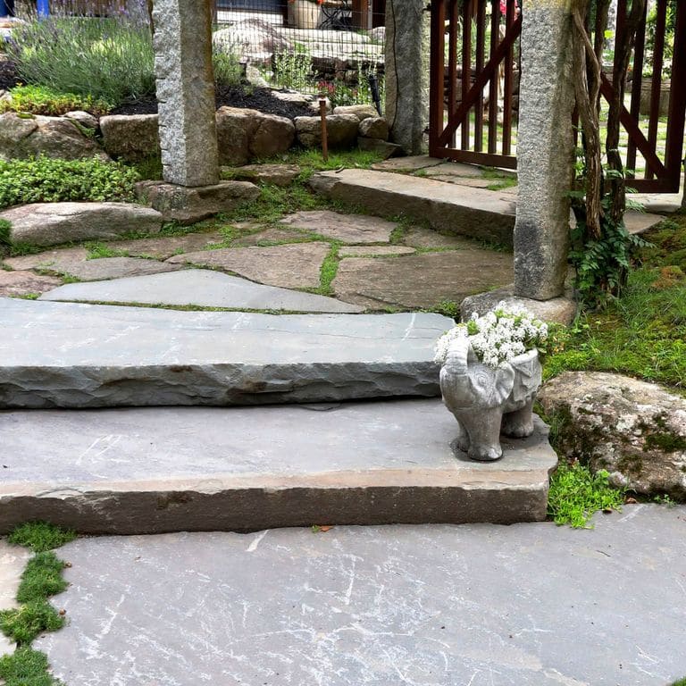 Application image for Bluestone Natural Cleft Full Color Mix - Jumbo Monolithic Steps. The image shows this product being used in a monolithic steps application. This is a building and landscape stone for indoor and outdoor commercial and residential applications. Suitable for general use, freeze-thaw conditions, high traffic areas, low slipperiness surfaces and high heel compatibilty situations. Relatively moderate in price.