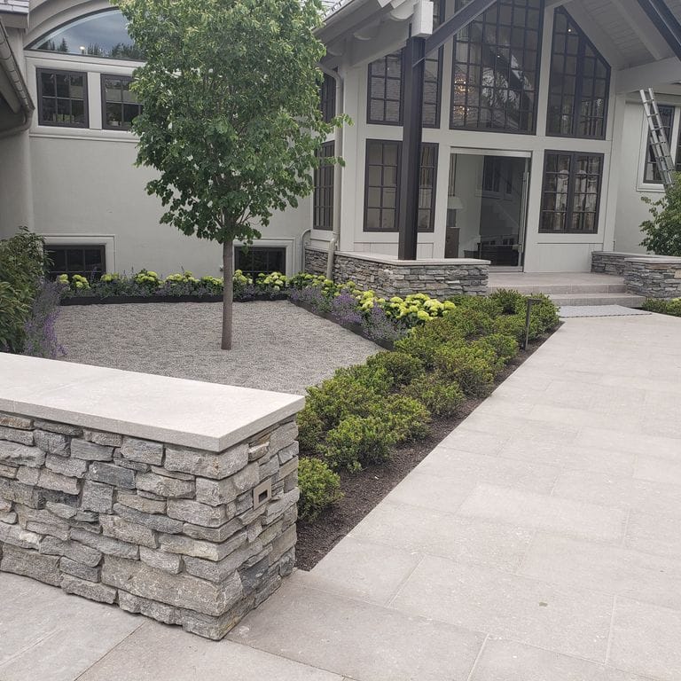 The image shows this product being used for driveway pavers, path pavers and patio pavers.