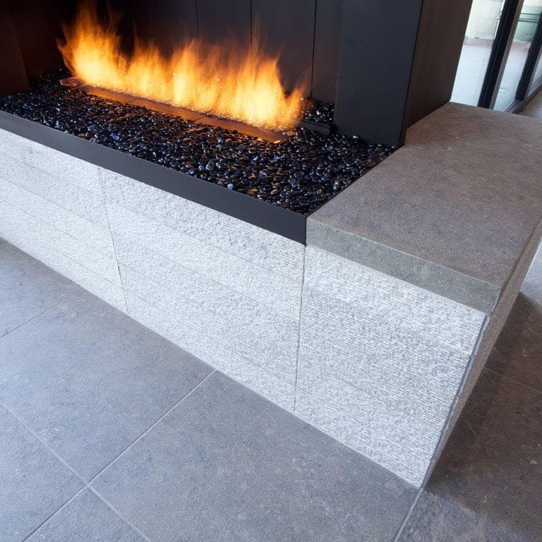 Application image for Portuguese Dawn Haze Limestone - Pavers. The image shows this product being used in an interior floor application. The dominant color shown is gray.