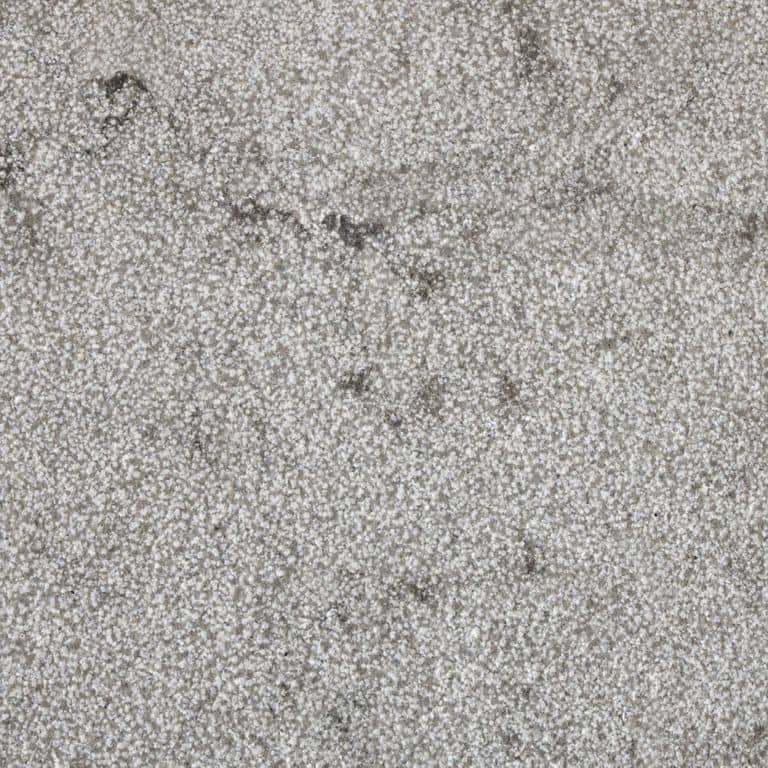 Color/Finish variation image for Dawn Haze Limestone - Treads. The surface finish shown is bush hammered. The dominant color shown is gray; with beige, purple and white secondaries. The color mix creates a cool feeling. Speckled, blotched and cloudy color patterns.