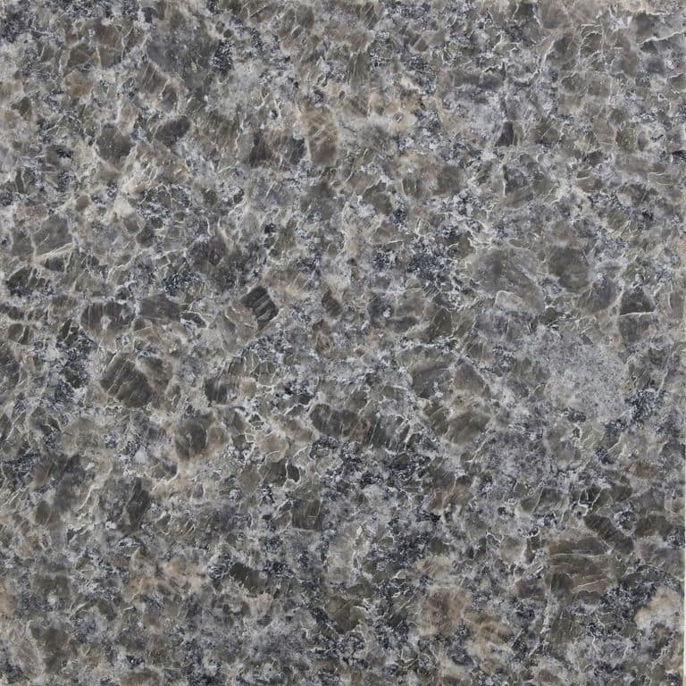 Color/Finish variation image for Caledonia Granite - Monolithic Steps. The surface finish shown is antiqued. The dominant color shown is gray; with brown, green and purple secondaries. The color mix creates a cool feeling. Coarse speckled and blotched color patterns.