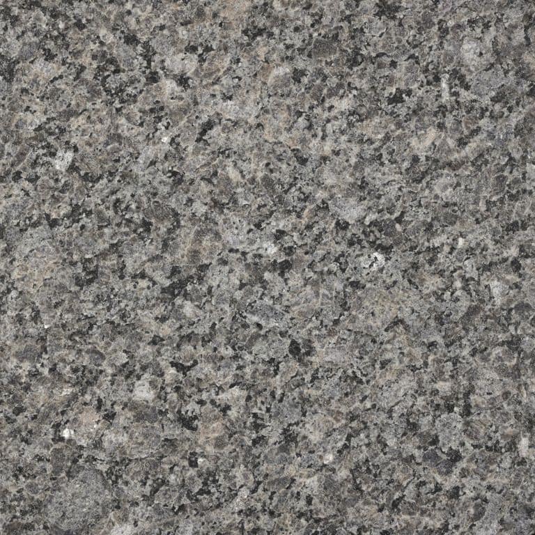 Swatch image cropped for Caledonia Granite - Monolithic Steps. The surface finish shown is flamed. The dominant color shown is gray; with brown, green and purple secondaries. Exhibits "movement" and the color mix creates a cool feeling. Veined and cloudy color patterns. Contains some mica and mineral inclusions.