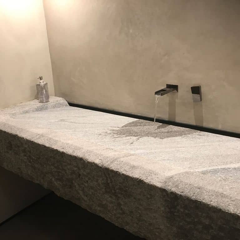 Application image for Reclaimed Granite Sinks. The image shows this product being used in a sinks application. Suitable for general use, freeze-thaw conditions, low heat absorption surfaces and low slipperiness surfaces situations. Moderate to higher on the price spectrum.