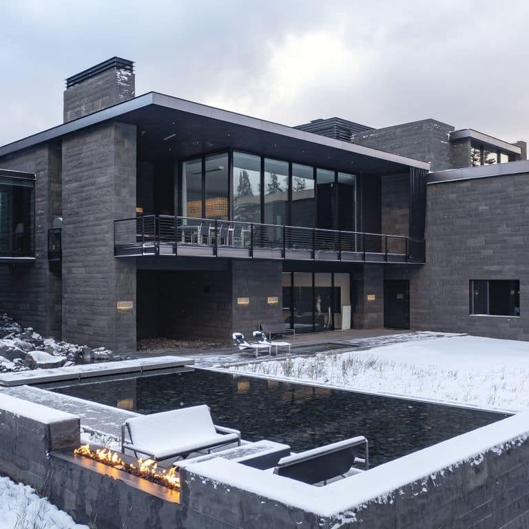 Application image for Ankar Gray Basalt - Cut to Size Veneer. The image shows this product being used for outdoor fire concepts and full bed veneer. The surface finish shown is split-face. The dominant color shown is gray. The color mix creates a cool feeling.