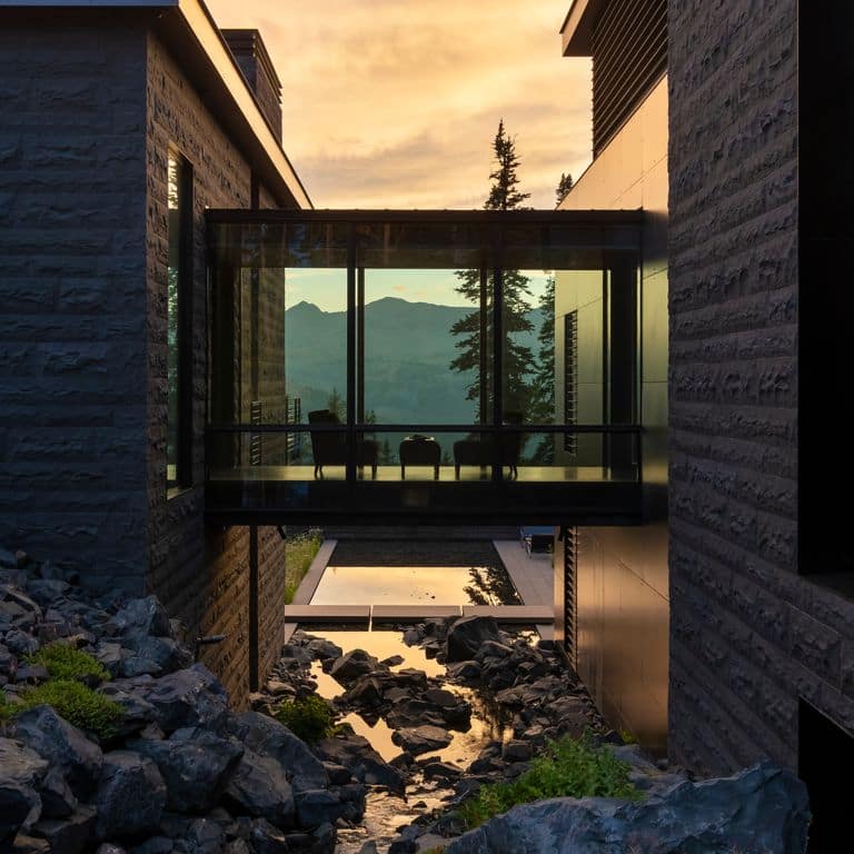 Application image for Ankar Gray Basalt - Cut to Size Veneer. The image shows this product being used in a full bed veneer application. The surface finish shown is split-face. Dominant colors shown are black and gray. The color mix creates a cool feeling.