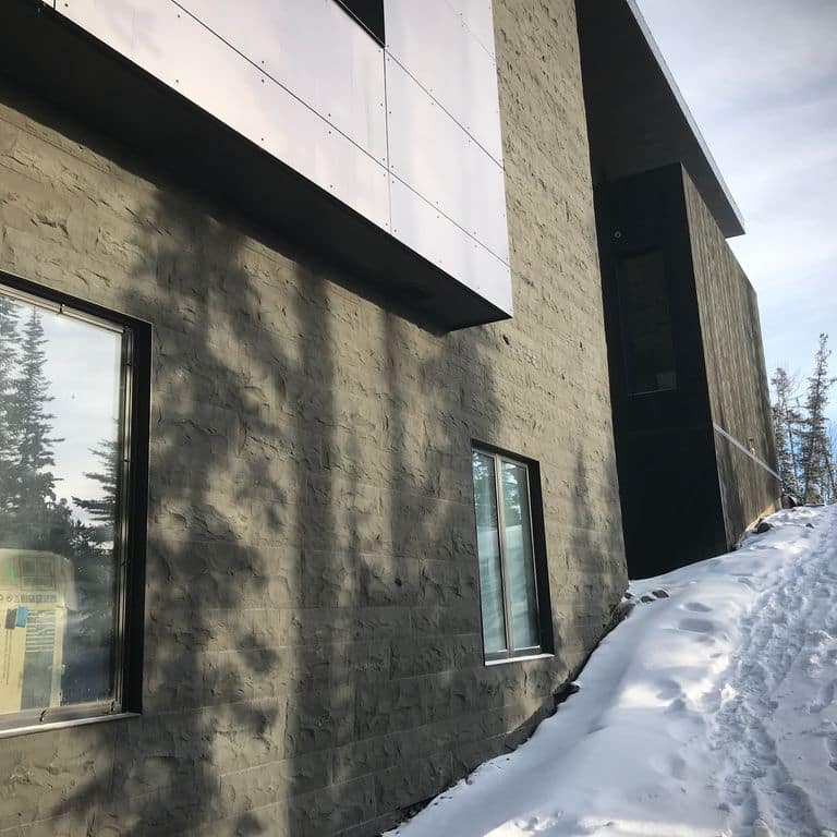 Application image for Basalt - Ankar Gray - Split Veneer. The image shows this product being used for full bed veneer and thin veneer. The surface finish shown is split-face. Dominant colors shown are black and gray.