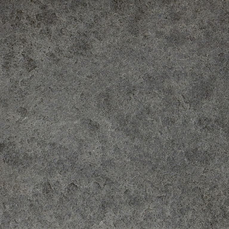 Swatch image for Ankar Black Basalt - Cobblestones. The surface finish shown is a combination of brushed and flamed. The dominant color shown is gray; with black, brown, green and purple secondaries. The color mix creates a cool feeling. Regular color pattern.