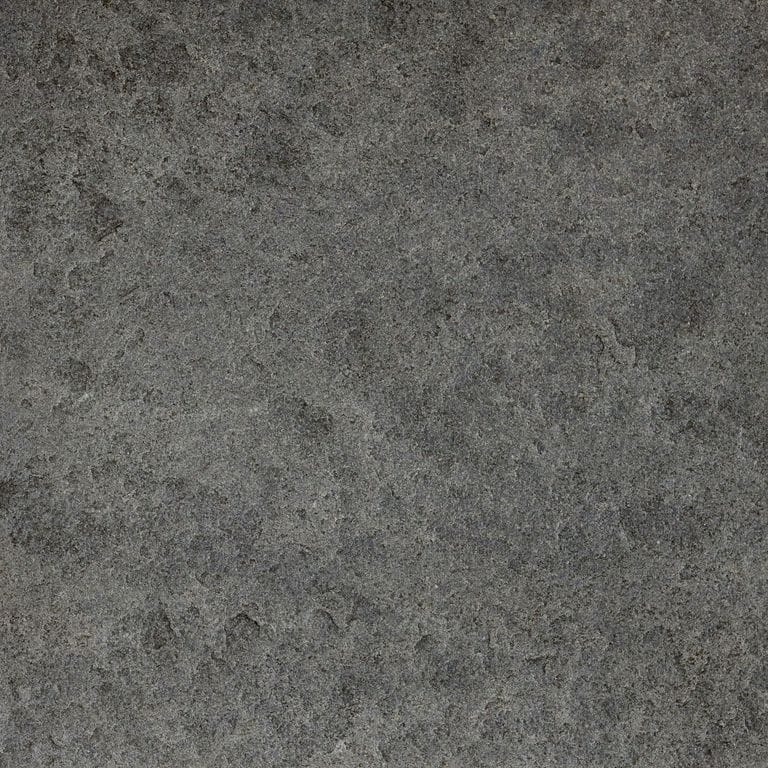 Color/Finish variation image for Ankar Black Basalt - Cobblestones. The surface finishes shown are brushed and flamed. The dominant color shown is gray; with black, brown, green and purple secondaries. The color mix creates a cool feeling. Blotched color pattern.