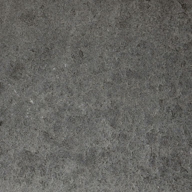 Color/Finish variation image for Ankar Black Basalt - Cobblestones. The surface finishes shown are brushed and flamed. The dominant color shown is gray; with black, brown, green and purple secondaries. The color mix creates a cool feeling. Blotched and cloudy color patterns.