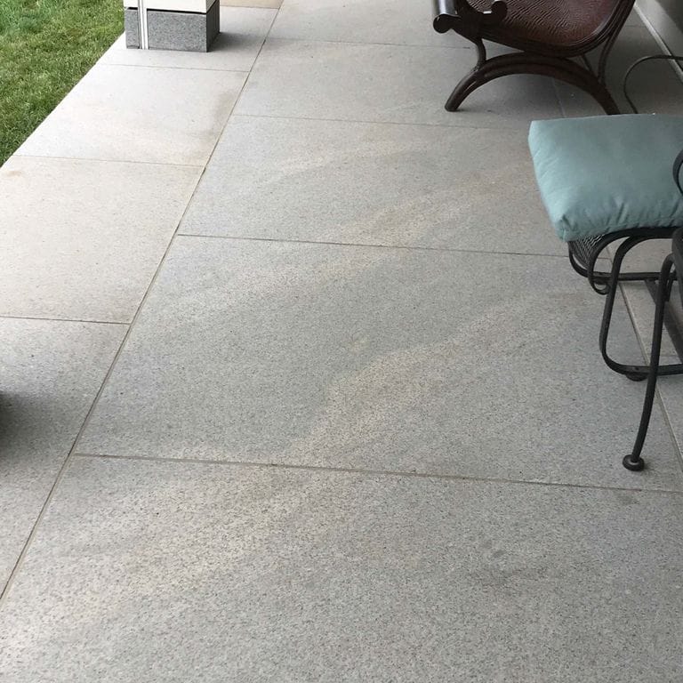 The image shows this product being used in a patio pavers application.