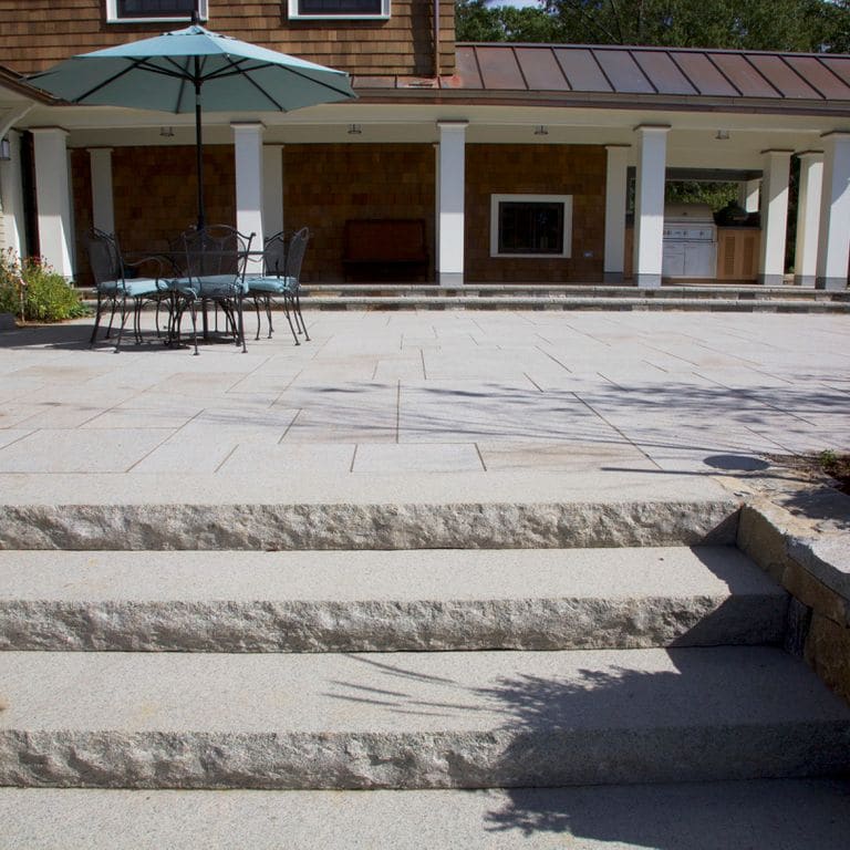 The image shows this product being used in a patio pavers application.