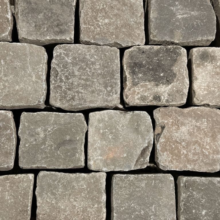 Color/Finish variation image for Reclaimed European Sandstone Cobblestones - Worn Cubes. The surface finish shown is . Dominant colors shown are brown and gray. The color mix creates a warm feeling.
