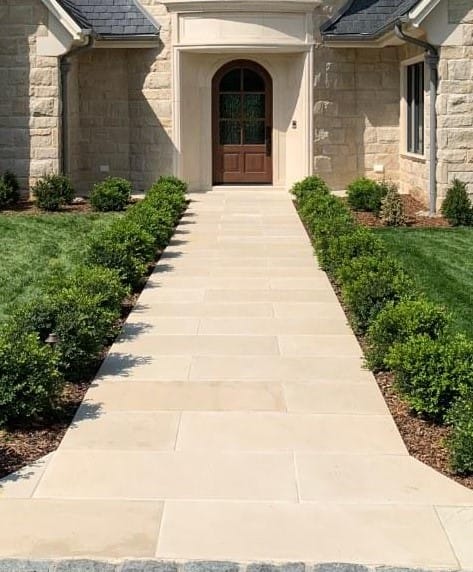 Close-up image for Sandstone - Portland White - Pavers. The surface finish shown is honed. Dominant colors shown are beige and tan; with a cream secondary. The color mix creates a warm feeling. Solid color pattern.