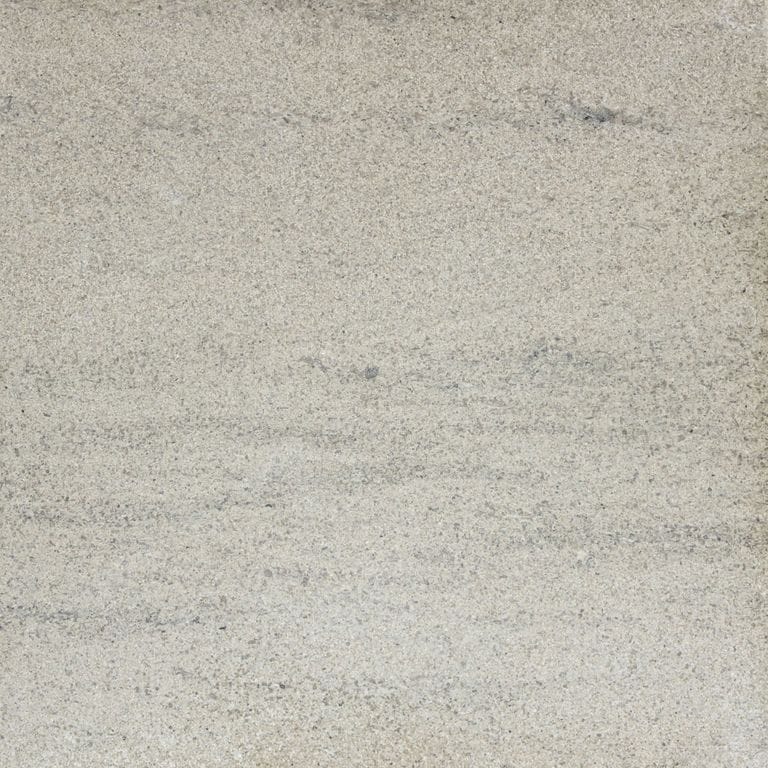 Best close-up image for Silver Shadow Limestone - Pavers. The image shows this product being used in a patio pavers application. The surface finish shown is honed. Dominant colors shown are beige and gray; with tan and cream secondaries. Exhibits "movement" and the color mix creates a cool feeling. Linear color pattern. Contains mineral inclusions.