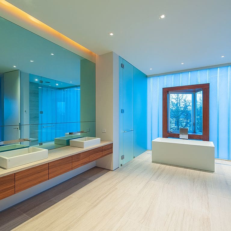 Feature image for Silver Shadow Limestone - Interior Flooring. The image shows this product being used in an interior floor application. Dominant colors shown are beige and cream; with gray, white and tan secondaries. Exhibits "movement" and the color mix creates a warm feeling. Linear color pattern.