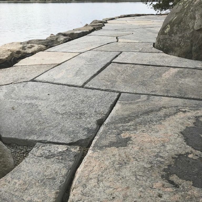 The image shows this product being used for path pavers and patio pavers.