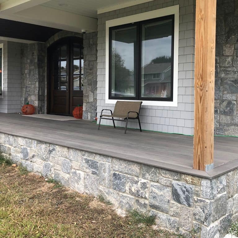 Feature image for Granite - Liberty Hill - Veneer. The image shows this product being used in a thin veneer application. The dominant color shown is gray; with beige, pink, white, tan and cream secondaries. Exhibits "movement". Random, speckled, blotched and streaked color patterns.