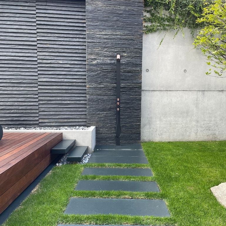 Application image for Black Schist - Wall Veneer. The image shows this product being used for full bed veneer and thin veneer. The surface finish shown is natural cleft. Dominant colors shown are black and gray. The color mix creates a cool feeling.