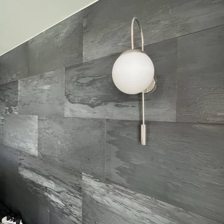 Application image for Black Schist - Cut to Size Veneer. The image shows this product being used for thin veneer and interior cladding. Dominant colors shown are black and gray. The color mix creates a cool feeling.