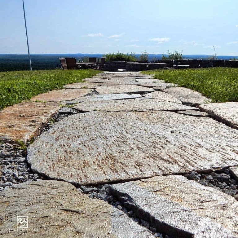 The image shows this product being used in a path pavers application.