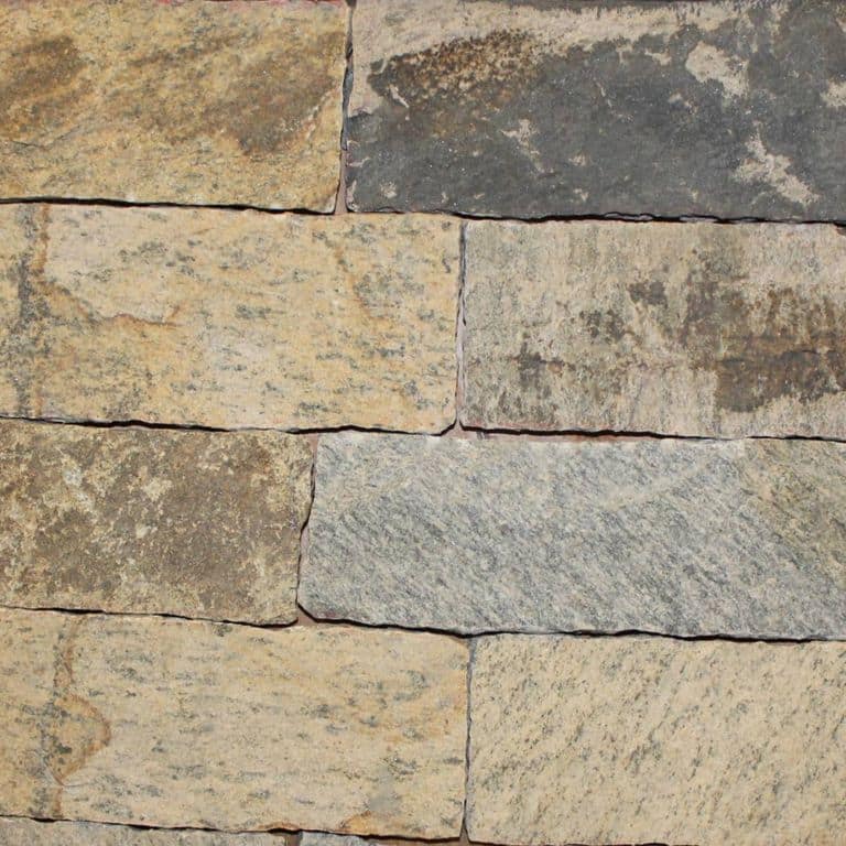 Close-up image for Nutmeg Ridge Granite - Veneer. The surface finish shown is natural. Dominant colors shown are brown and tan; with beige, gray and orange/rust secondaries. Exhibits "movement" and the color mix creates a warm feeling. Blotched and streaked color patterns.