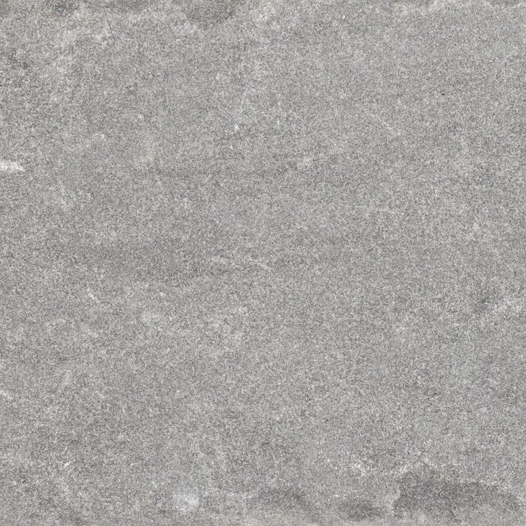 Swatch image cropped for Bluestone Blue/Gray - Cobblestone Pavers. The surface finishes shown are flamed and tumbled. The dominant color shown is gray; with beige and white secondaries. The color mix creates a cool feeling. Fine speckled and cloudy color patterns.