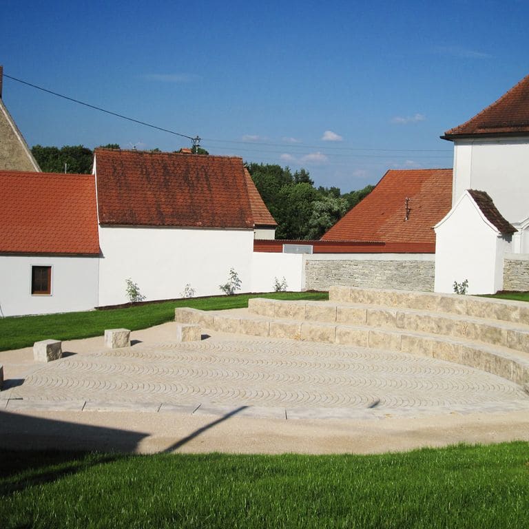 Application image for Bavarian Dolomite - Gray - Benches &amp; Seating. The image shows this product being used in a seating &amp; benches application. This is a building and landscape stone for indoor and outdoor commercial and residential applications. Suitable for general use, freeze-thaw conditions and low heat absorption surfaces situations. Moderate to higher on the price spectrum.