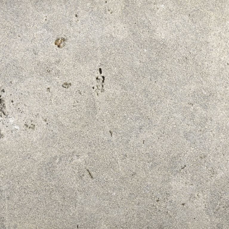 Color/Finish variation image for Bavarian Dolomite - Gray - Cobblestones. The surface finish shown is sand blasted. Dominant colors shown are beige and gray; with white, tan and cream secondaries. The color mix creates a warm feeling. Random, fine speckled, blotched and cloudy color patterns.