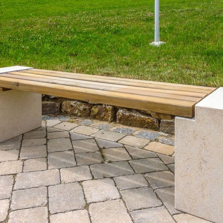 Application image for Bavarian Dolomite Gray Limestone - Cobblestones. The image shows this product being used in a patio pavers application. Dominant colors shown are gray and tan. The color mix creates a warm feeling.