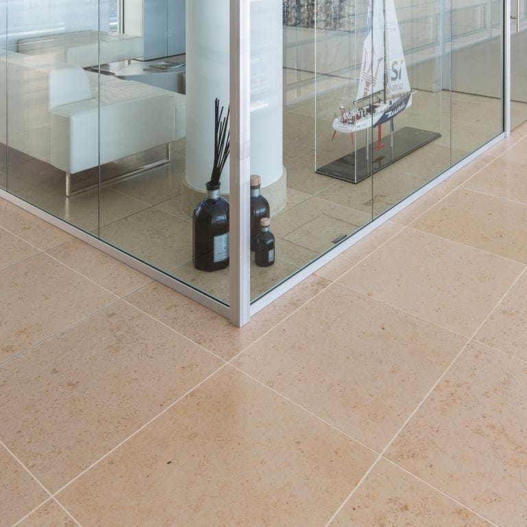 Application image for Bavarian Limestone - Beige - Interior Floor. The image shows this product being used in an interior floor application. Dominant colors shown are tan and cream. The color mix creates a warm feeling.