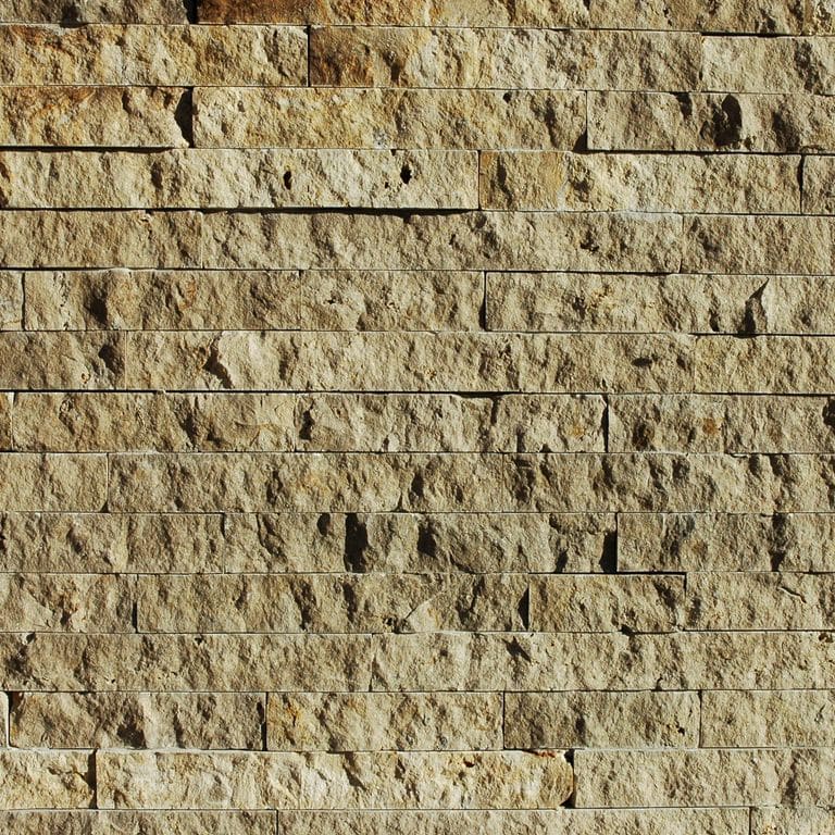 Close-up image for Bavarian Dolomite - Gray - Wall Veneer. The surface finish shown is split-face. Dominant colors shown are brown and tan; with a beige secondary. Exhibits "movement" and the color mix creates a warm feeling. Regular color pattern.