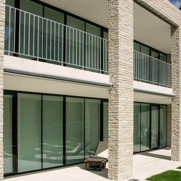 Application image for Bavarian Beige Limestone - Veneer. The image shows this product being used for full bed veneer and thin veneer. The surface finish shown is split-face. Dominant colors shown are beige and tan. The color mix creates a warm feeling.